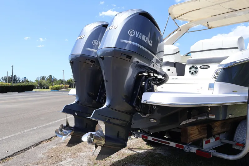 Slide: The Image of 2019 Regal 29 OBX boat with dual Yamaha outboard engines on a trailer. - 7