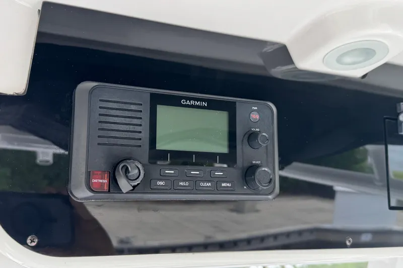 Slide: The Image of Garmin marine radio on 2019 Edgewater 230CC boat dashboard. - 49