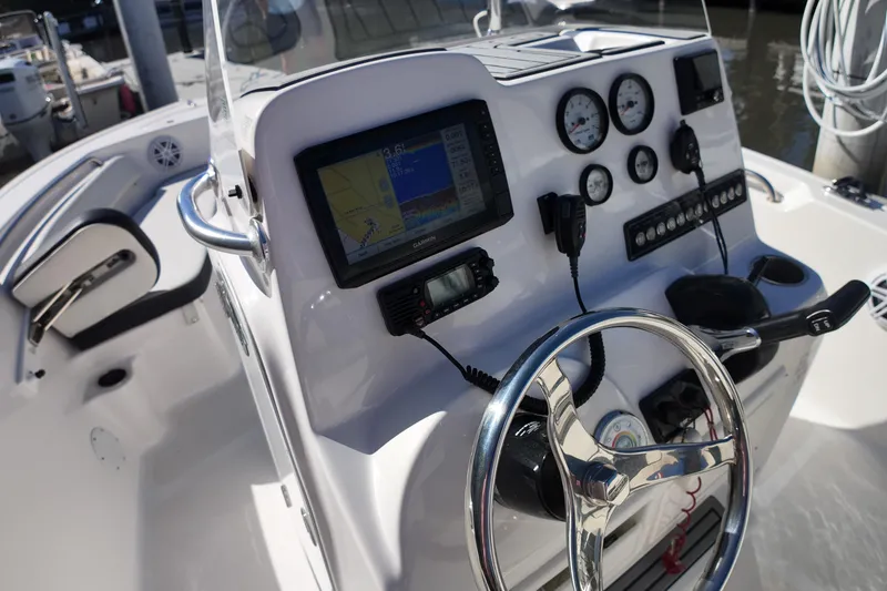 Slide: The Image of 2022 Tidewater 198 CC Adventure boat dashboard with navigation and control instruments. - 18