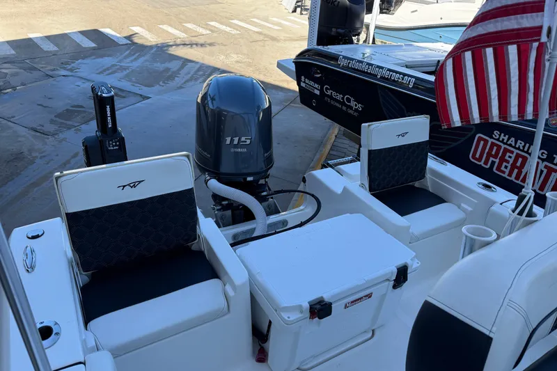 Slide: The Image of 2022 Tidewater 198 CC Adventure boat with Yamaha 115 engine and American flag. - 27
