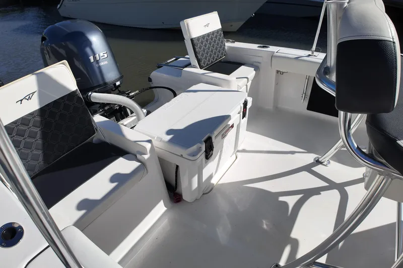 Slide: The Image of 2022 Tidewater 198 CC Adventure boat interior with Yamaha 115 engine and seating. - 30