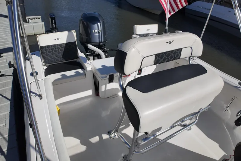 Slide: The Image of 2022 Tidewater 198 CC Adventure boat interior with seating and Yamaha 115 engine. - 31