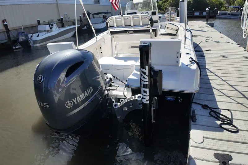 Slide: The Image of 2022 Tidewater 198 CC Adventure boat with Yamaha motor docked at marina. - 34