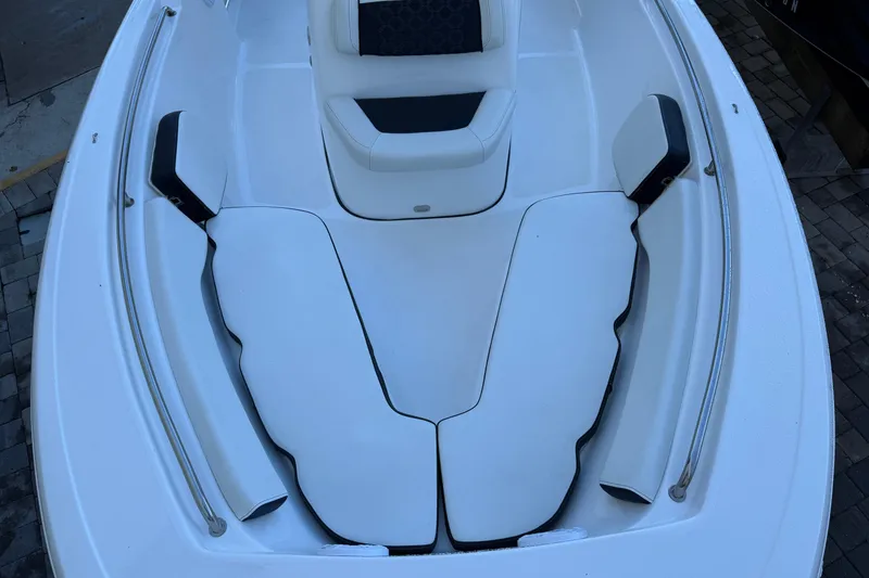 Slide: The Image of 2022 Tidewater 198 CC Adventure boat interior with cushioned seating. - 9