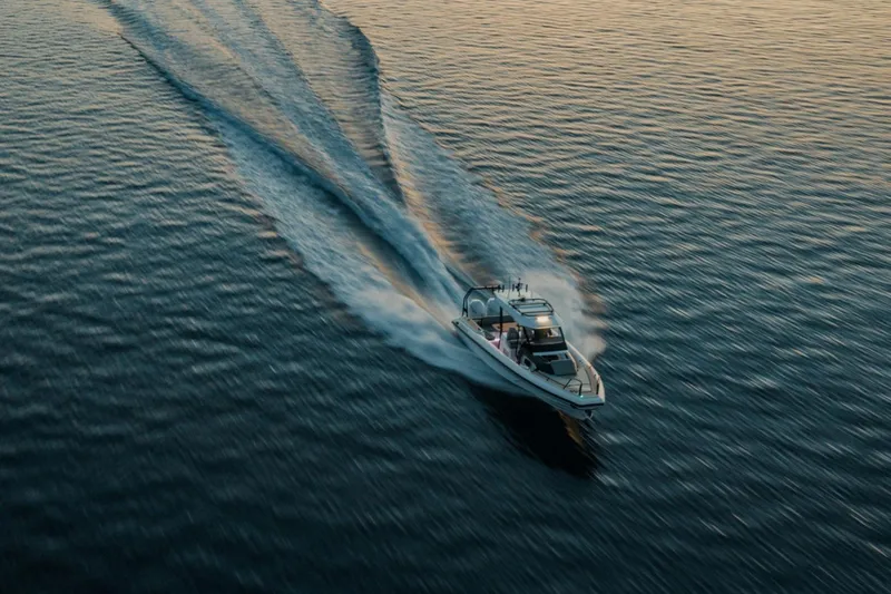 Slide: The Image of Highfield ADV7 2026 boat cruising on calm water at sunset. - 3