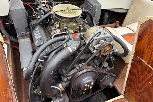 Slide: The Image of 1986 Galaxie Bowrider engine, detailed view of mechanical components and belts. - 18