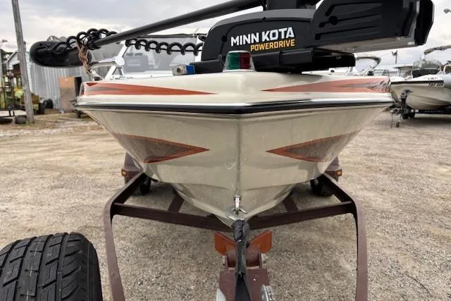 Slide: The Image of 1986 Galaxie Bowrider boat with Minn Kota PowerDrive, parked on a trailer. - 8