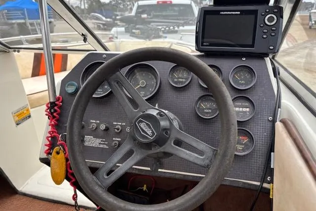 Slide: The Image of 1986 Galaxie Bowrider dashboard with steering wheel and navigation system. - 9