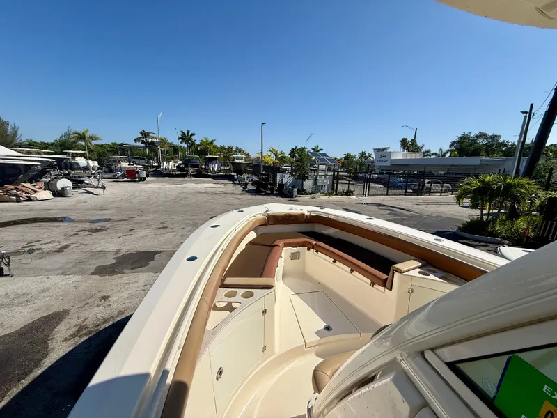 Slide: The Image of Scout 275 LXF 2015 boat docked in sunny marina. - 13