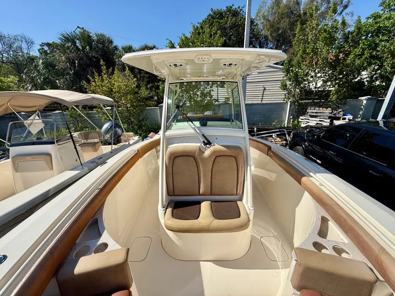 Slide: The Image of Scout 275 LXF 2015 boat with seating area and helm console. - 15