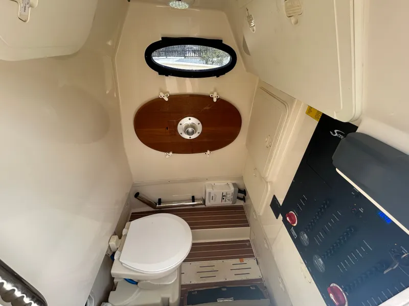 Slide: The Image of Interior of 2015 Scout 275 LXF with toilet and control panel. - 17