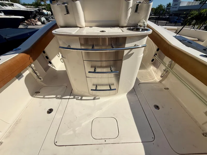 Slide: The Image of Interior view of a 2015 Scout 275 LXF boat with storage area. - 18