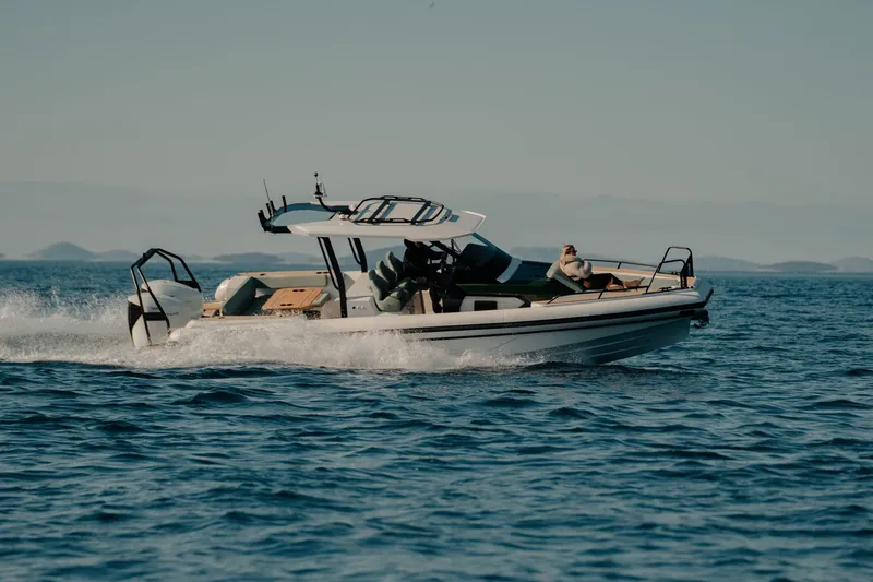 The Image of 2026 Highfield ADV7 boat cruising on open water under clear skies. - 0