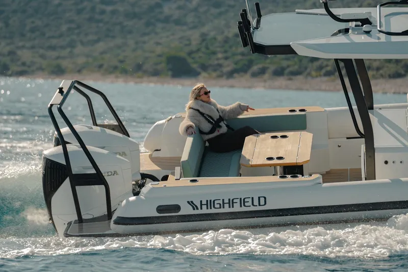 Slide: The Image of 2026 Highfield ADV7 boat cruising with a relaxed passenger on deck. - 4