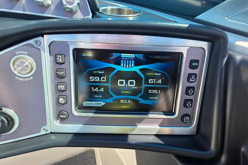 Slide: The Image of 2018 MasterCraft XT23 dashboard display showing air and water temperature, speed, and voltage. - 20