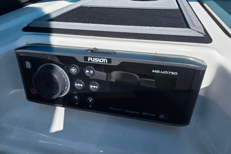 Slide: The Image of Fusion MS-UD750 audio system on 2018 MasterCraft XT23 boat dashboard. - 24