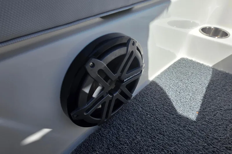 Slide: The Image of Speaker on 2018 MasterCraft XT23 boat interior with carpeted flooring. - 28