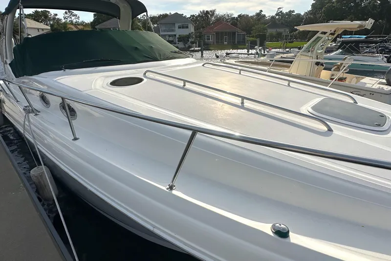 Slide: The Image of 2003 Sea Ray 340 Sundancer docked at a marina. - 11