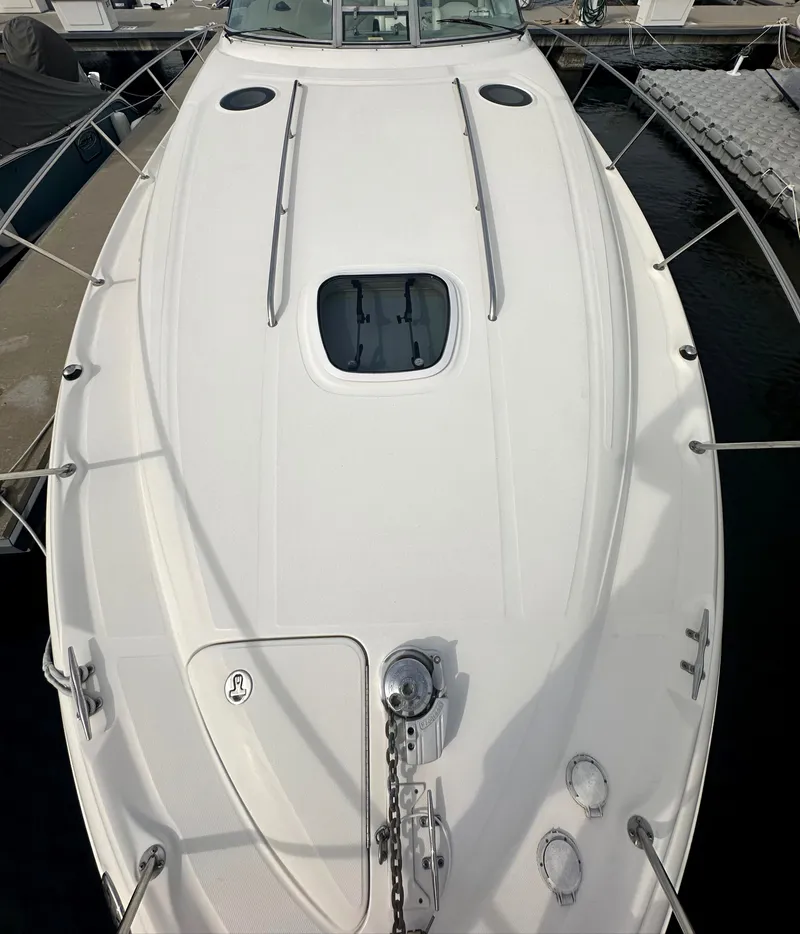 Slide: The Image of 2003 Sea Ray 340 Sundancer boat deck with anchor and hatch. - 15