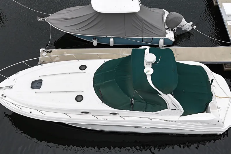 Slide: The Image of 2003 Sea Ray 340 Sundancer yacht docked, aerial view with green canopy. - 5