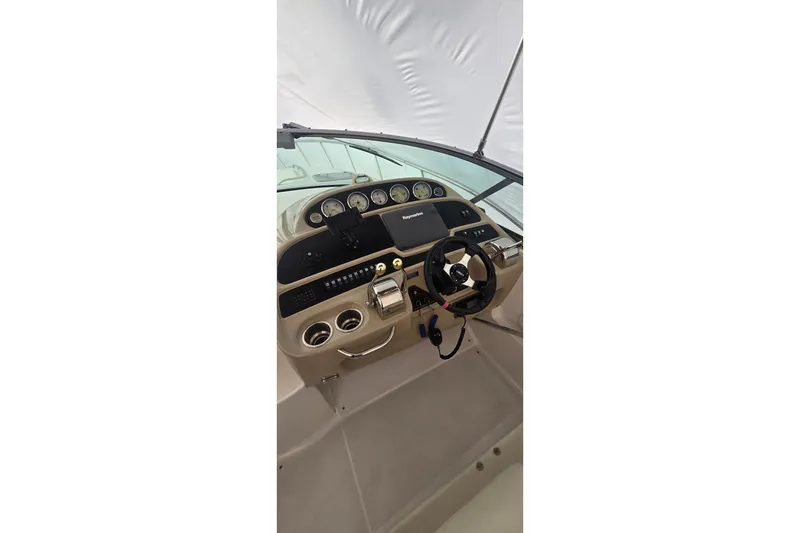 Slide: The Image of 2005 Chaparral Signature 350 boat dashboard with steering wheel and gauges. - 10