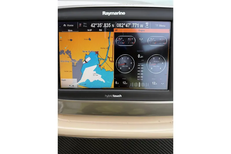 Slide: The Image of Raymarine navigation display on 2005 Chaparral Signature 350 boat, showing map and engine data. - 12