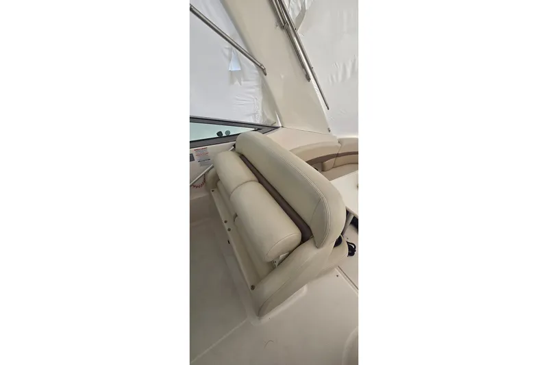 Slide: The Image of 2005 Chaparral Signature 350 boat interior with beige seating and sleek design. - 13