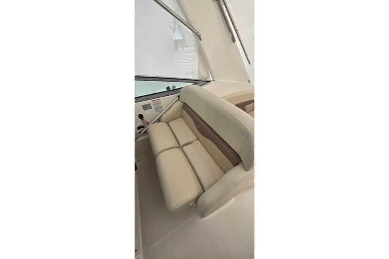 Slide: The Image of 2005 Chaparral Signature 350 boat interior with beige seating and control panel. - 14