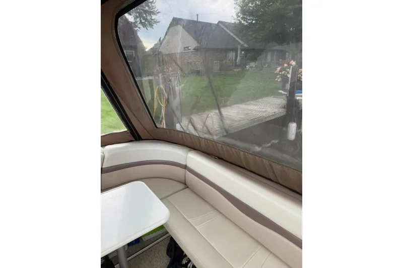 Slide: The Image of Interior view of 2005 Chaparral Signature 350 boat with seating and window. - 16