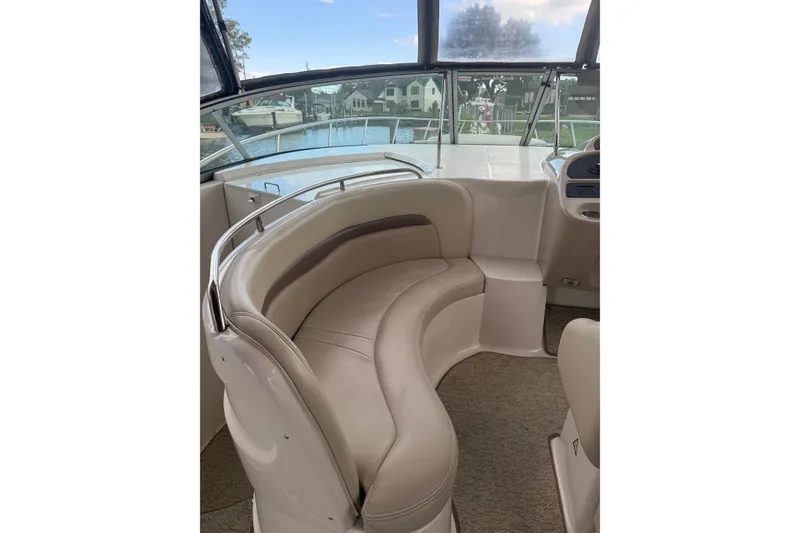 Slide: The Image of 2005 Chaparral Signature 350 boat interior with curved seating and helm view. - 18