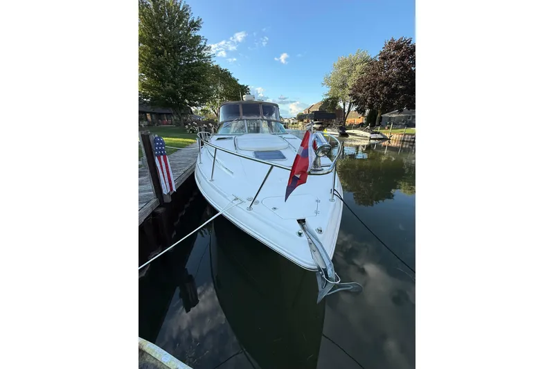 Slide: The Image of Chaparral Signature 350 boat, 2005 model, docked in a serene marina setting. - 2