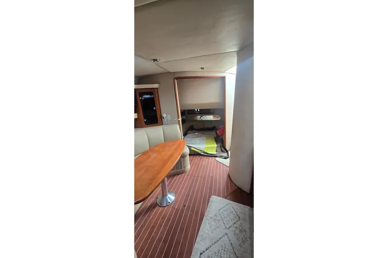 Slide: The Image of 2005 Chaparral Signature 350 interior with wooden table and seating area. - 26