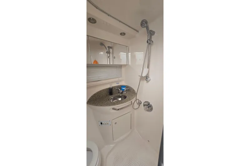 Slide: The Image of 2005 Chaparral Signature 350 bathroom with shower, sink, and mirror. - 28