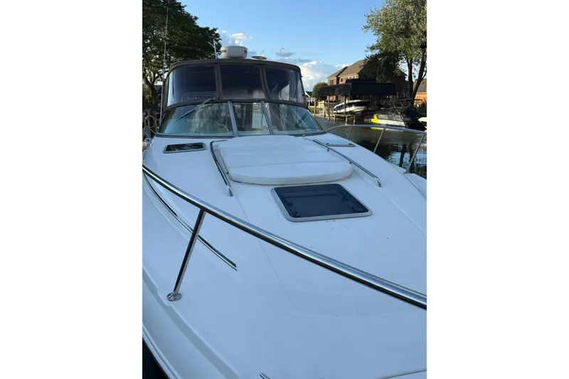 Slide: The Image of 2005 Chaparral Signature 350 boat docked, featuring sleek design and spacious deck. - 3