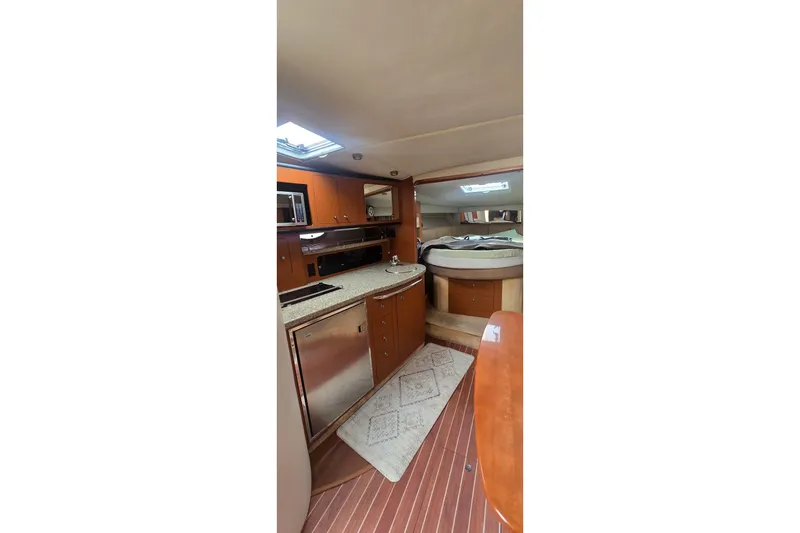 Slide: The Image of Interior of 2005 Chaparral Signature 350 yacht with kitchen and sleeping area. - 30