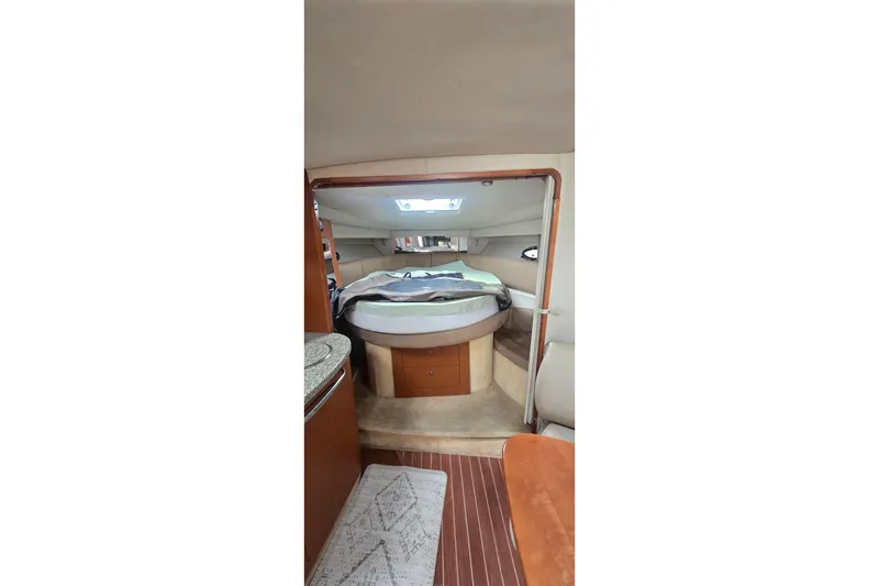 Slide: The Image of Interior of 2005 Chaparral Signature 350 boat, featuring cozy sleeping quarters. - 31