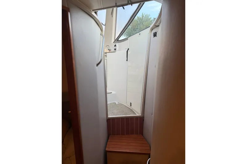 Slide: The Image of 2005 Chaparral Signature 350 interior with wooden bench and curved walls. - 35