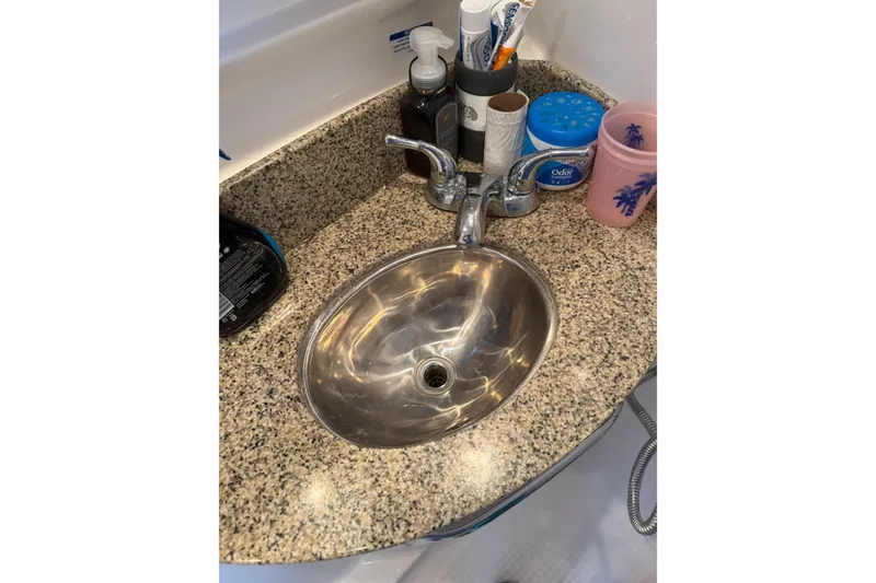 Slide: The Image of Granite countertop with sink in 2005 Chaparral Signature 350 boat bathroom. - 41