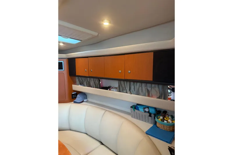 Slide: The Image of Interior of 2005 Chaparral Signature 350 yacht with seating and storage cabinets. - 43