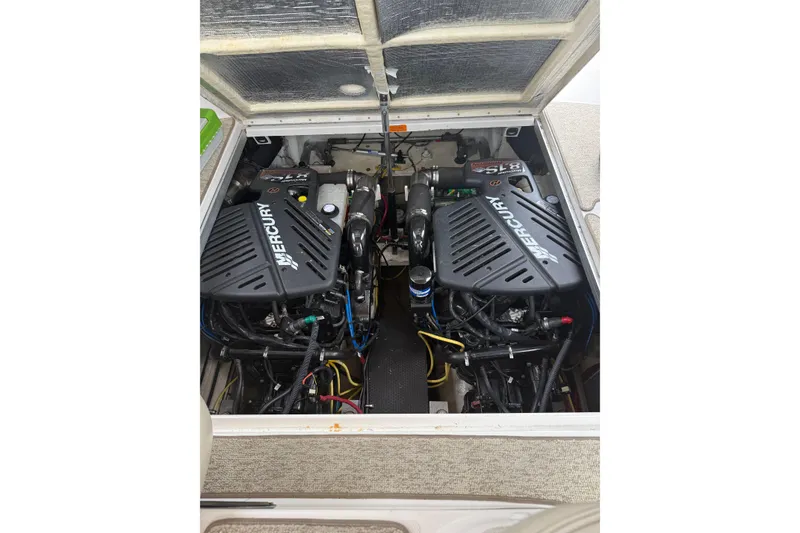 Slide: The Image of Twin Mercury engines in a 2005 Chaparral Signature 350 boat engine compartment. - 47