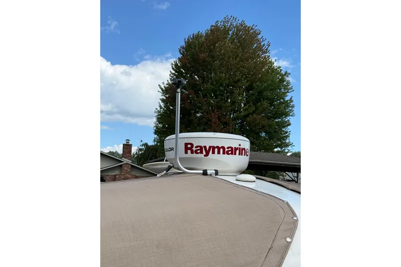 Slide: The Image of 2005 Chaparral Signature 350 with Raymarine radar against a clear sky backdrop. - 6