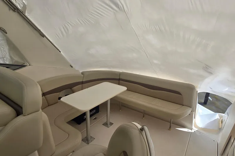 Slide: The Image of Interior of 2005 Chaparral Signature 350 boat with beige seating and table. - 7