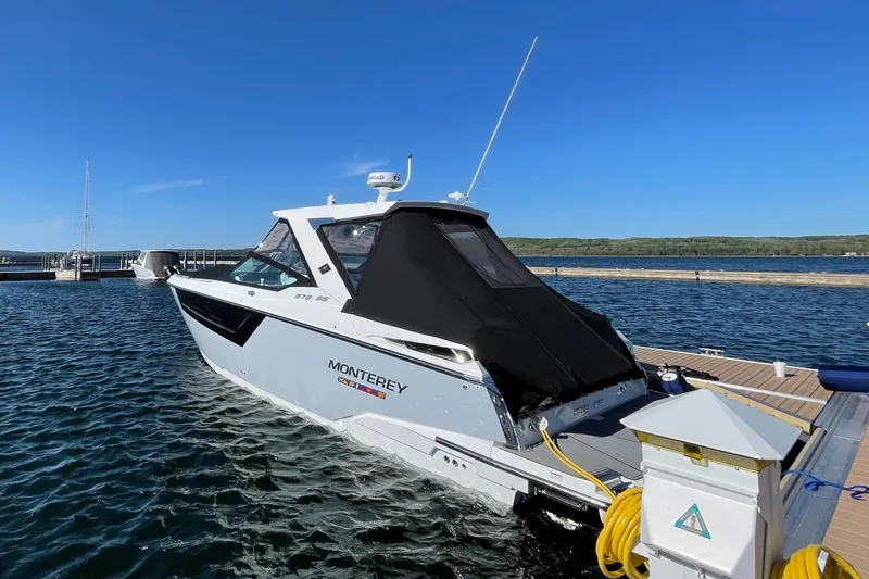The Image of 2022 Monterey 378SS Super Sport boat docked at marina under clear blue sky. - 0