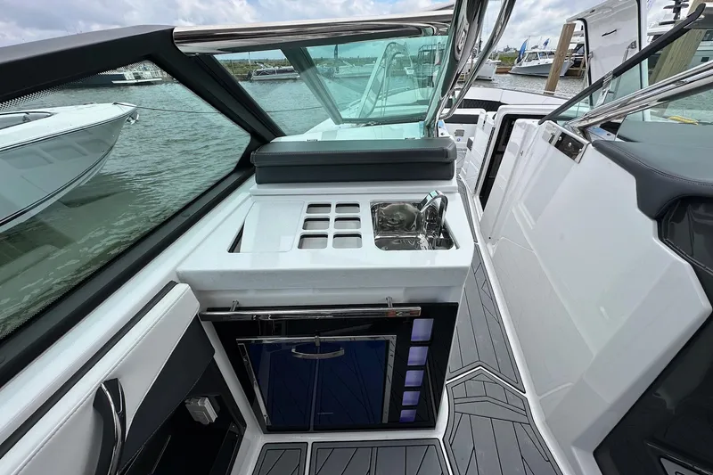 Slide: The Image of 2022 Monterey 378SS Super Sport boat interior with sleek kitchenette and modern design. - 10