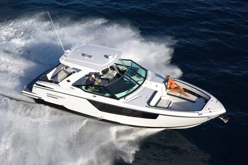 Slide: The Image of Manufacturer Provided Image: 2022 Monterey 378SS Super Sport cruising on open water, showcasing sleek design and luxury features. - 15