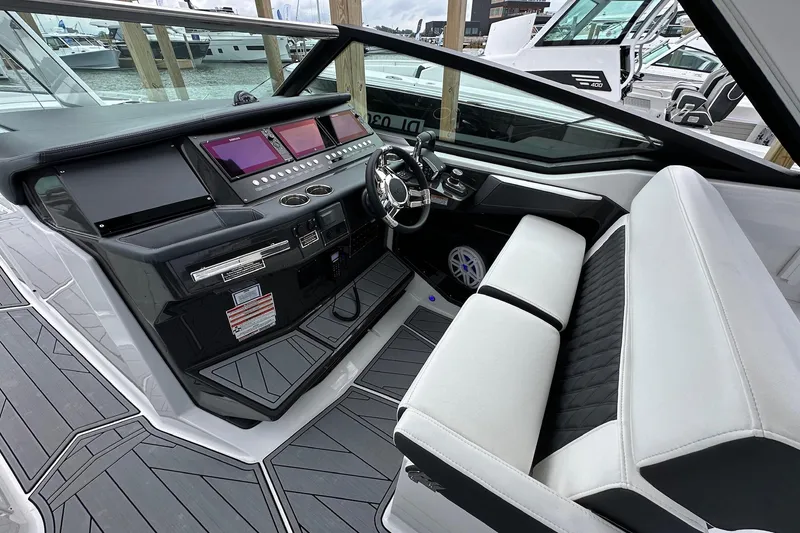 Slide: The Image of 2022 Monterey 378SS Super Sport boat interior with modern dashboard and seating. - 7