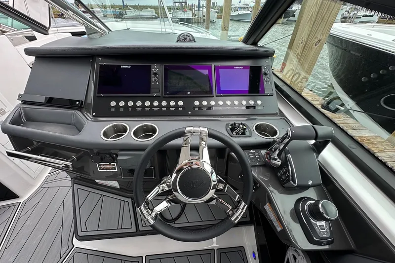 Slide: The Image of 2022 Monterey 378SS Super Sport boat dashboard with advanced controls and navigation screens. - 8