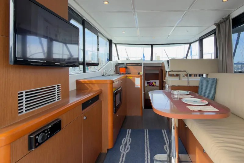 Slide: The Image of Interior of 2016 Beneteau Swift Trawler 30 with modern amenities and dining area. - 10