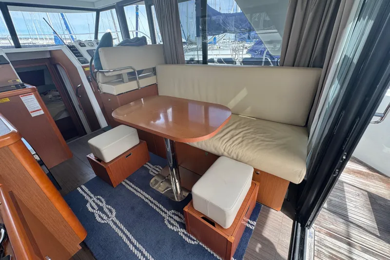 Slide: The Image of Interior of 2016 Beneteau Swift Trawler 30 with seating and table arrangement. - 17