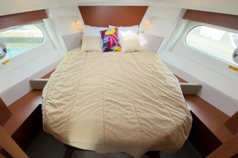 Slide: The Image of Cozy cabin interior of 2016 Beneteau Swift Trawler 30 with comfortable bedding. - 22